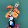 Fun tropical parrot filler of nice and fragrant roses.