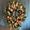 Funeral wreath in pastel colors.