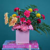 Pink and yellow mixed bouquet in a pink vase
