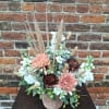 A toasty-warm seasonal design created in neutral toned, leaf-accented pottery, featuring white