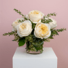 A half dozen Garden Roses arranged in a flared cylinder vase. The