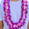 A vibrant orchid lei designed to celebrate lifes biggest moments from NYU