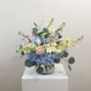 Designed in a glass cylinder, this arrangement highlights the calming properties of