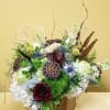 This arrangement is in a large gold cylinder and is inspired by