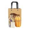 Gift bag with a glass bottle of dried flowers and a bundle of orange candles
