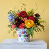  The arrangement features a diverse mix of flowers, each contributing to