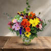 Colorful mixed bouquet in a clear glass vase