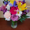 Colorful mixed bouquet in a clear glass vase