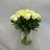 Bouquet of white roses in a clear glass vase