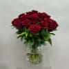 Bouquet of deep red roses in a clear glass vase