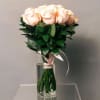 Bouquet of pale pink roses in a clear glass vase