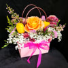 Surprise your loved one with this beautiful tote inspired arrangement with gorgeous