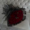 Bouquet of red roses wrapped in black polka-dot paper