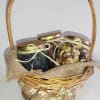 Basket of three lidded jars tied with ribbon