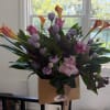 Bouquet of pink and lavender flowers in a kraft paper wrap