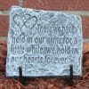 Decorative stone plaque with a heart design and engraved memorial quote