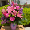 The beautiful Dragonfly arrangement has Lily&rsquo;s, Roses, Snapdragons, and stock