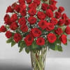 Bouquet of red roses in a clear glass vase