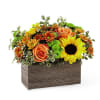 Orange roses and yellow sunflowers in a rectangular wooden box