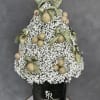 White baby's breath arrangement with gold ornaments and green bows in a black box