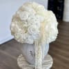A breathtaking all-white arrangement designed to embody sophistication and serenity. Featuring lush
