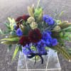 This arrangement is made up of various textural and seasonal elements. This