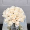 This glittered rose arrangement comes a glass round vase. For a glitter