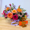 Mixed bouquet in a wooden box with a teddy bear and candy box