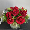 Beautifully designed in a 5x5 clear vase using imported long stem red