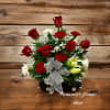 Red roses and carnations in a black car-shaped container with a silver bow