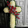 This is a beautiful floral cross arrangement made with densely packed white