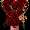 Tall red rose heart arrangement with pink daisies in a pink hatbox with gold butterfly accents