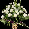 Tall white and green flower arrangement with purple orchids in a gold geometric vase