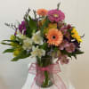 Give a colorful assortment of fresh alstroemeria and mini gerbera daisies, vased