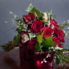 A wonderful hand tied bouquet of roses, accent flowers and mixed green