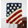 A formal American flag tribute crafted for memorial and funeral services, this
