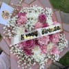 Pink and white bouquet with a birthday ribbon