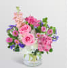Pink and purple mixed bouquet in a clear glass vase