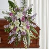 Standing floral spray with white lilies, pink roses, and lavender flowers