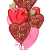 Heart-shaped Valentine’s Day balloons in red, pink, and gold