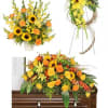 Yellow and orange floral funeral arrangements with sunflowers and roses