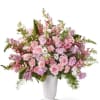 Pink and lavender floral arrangement in a white vase