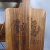 A rustic wooden paddle board engraved with "Christ is my Anchor" creates