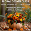 Pumpkin filled with orange, yellow, and red flowers