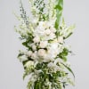 Tall white floral standing arrangement with roses and orchids
