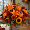 Bright, harvest-inspired and full of texture, this autumn centerpiece is a flower