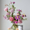 A beautiful arrangement designed in our adorable posie vase and accompanied with