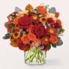 Rich, autumn tones are expertly arranged by your local florist to create