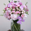 This exquisite flower bouquet in rich shades of pink showcases a captivating