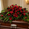 A dense, horizontal spray of deep red blooms makes a powerful, reverent